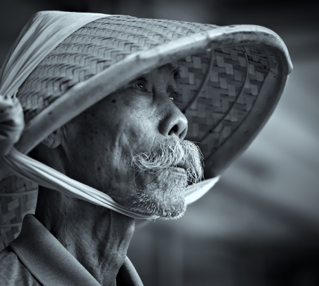 man wearing bamboo hat