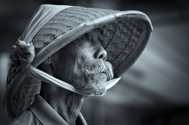 man wearing bamboo hat